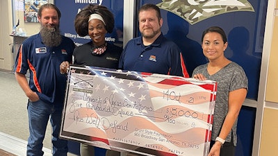From left to right: Will Lansdon, UTSA Veteran and Military Affairs (VMA); Tiffany Orner, Grunt Style; Michael Logan, VMA; and Jessica Lerma, Grunt Style; with the $5,000 check from the Grunt Style Foundation.