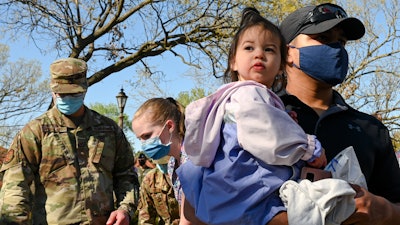 Military families participate in a parade at Barksdale Air Force Base, La., April 1, 2021, to commemorate Month of the Military Child as well as National Child Abuse Prevention Month.