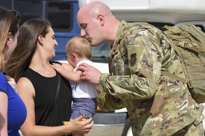 Mil Air National Guardsman Kisses Baby 1800